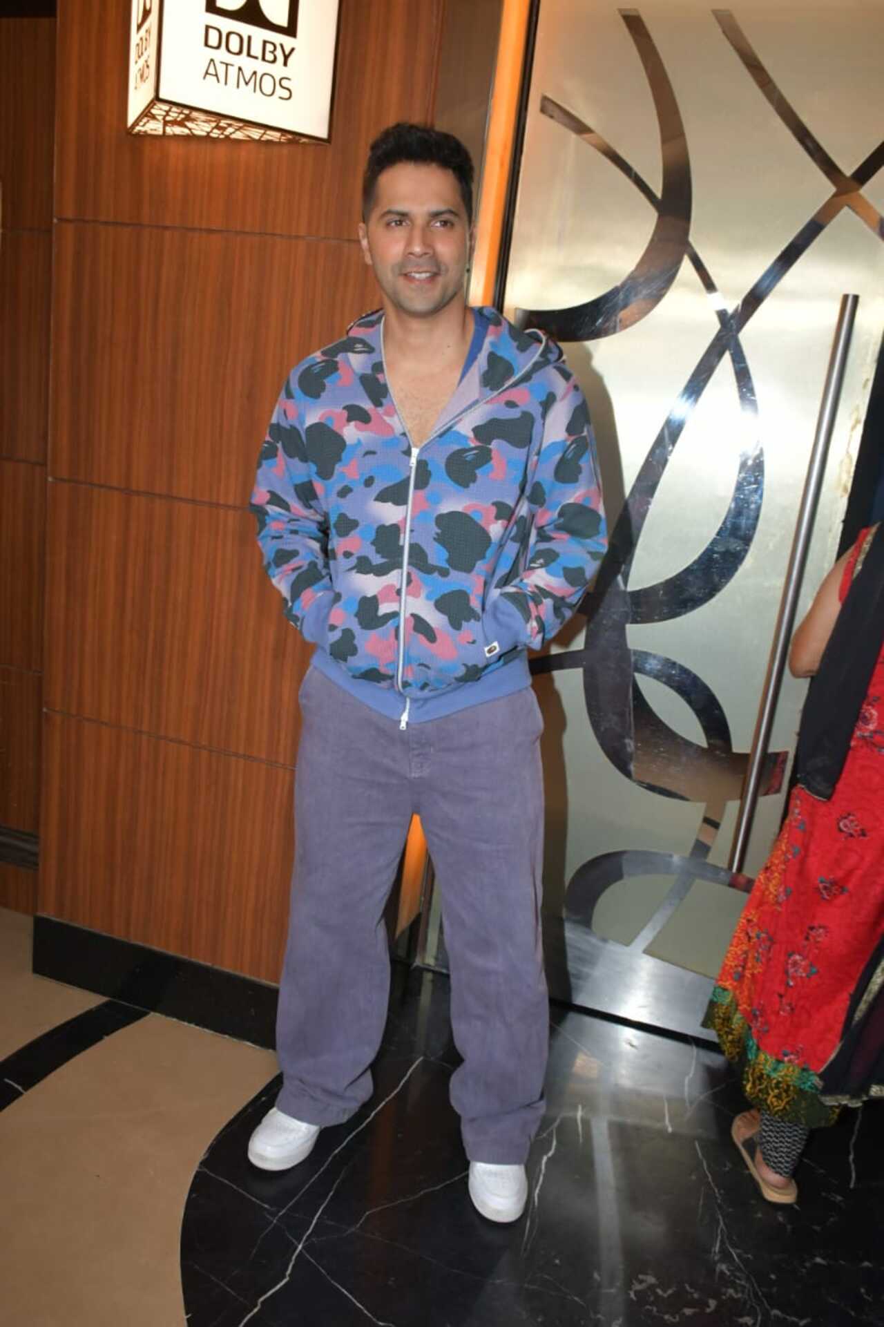 Varun Dhawan was seen in a multi-coloured jacket and denim pants for the screening night